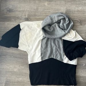 Three-quarter length sleeve sweater with cowl neck.